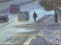 Pedestrian in snowy street.