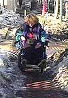 Photo - Wheelchair user struggles in snow 